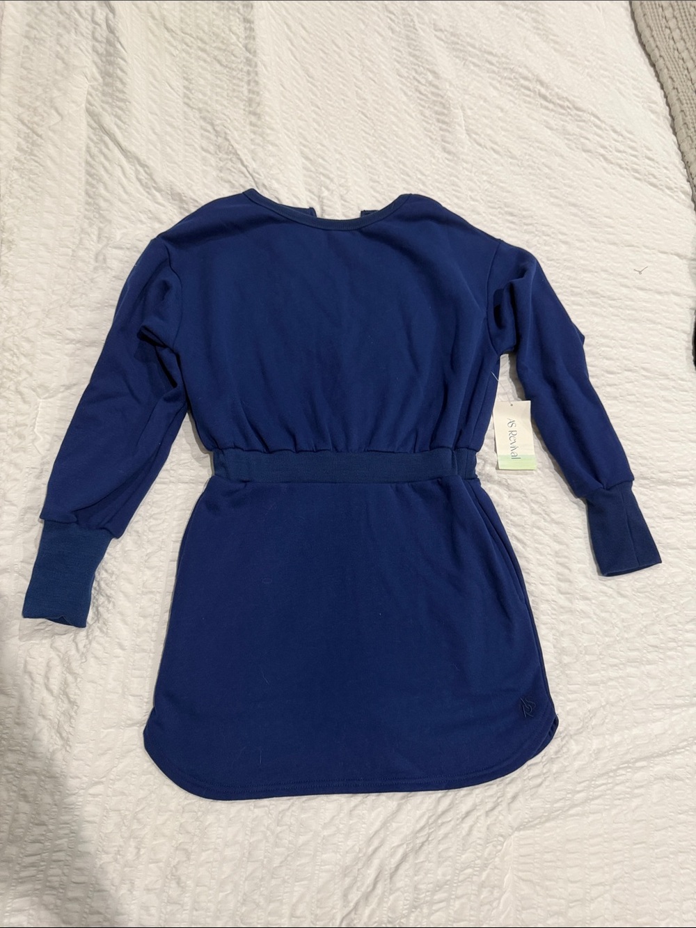 As Revival women’s sweater dress with back cut out.